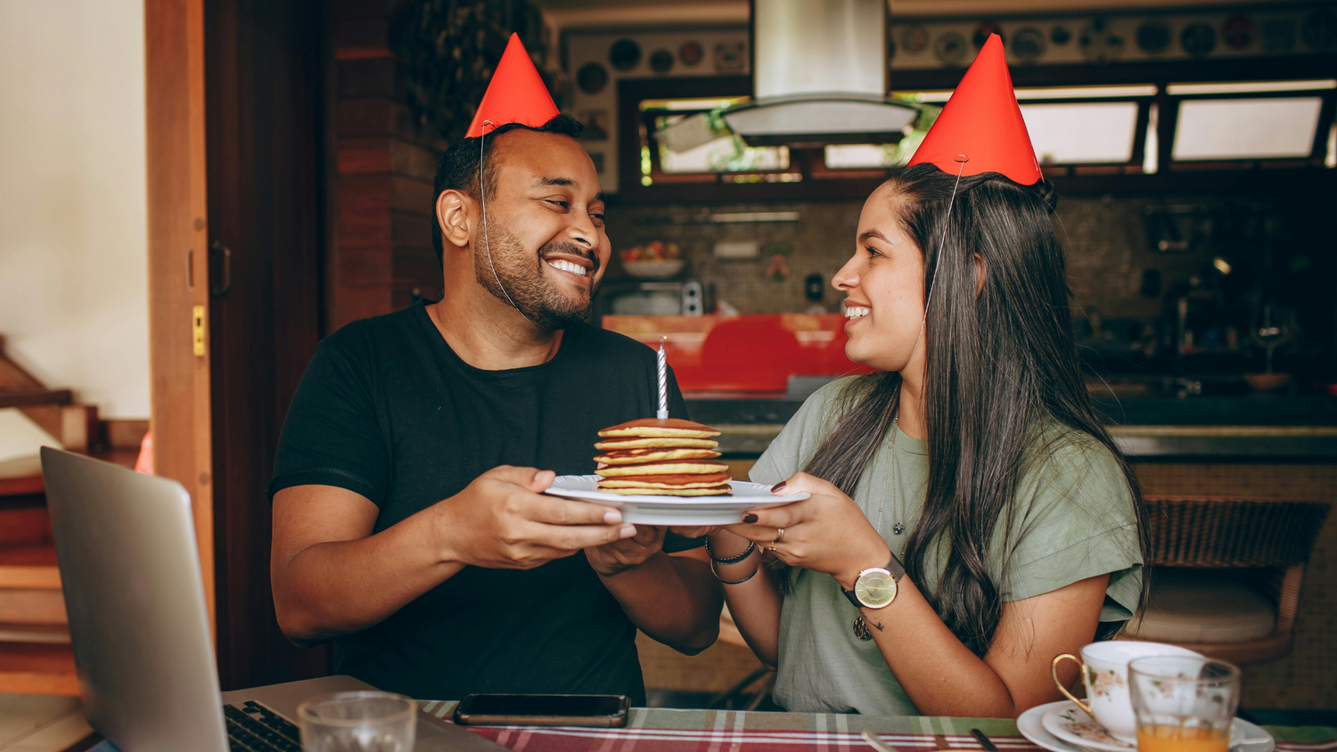 couple enjoying date night at home with pancakes